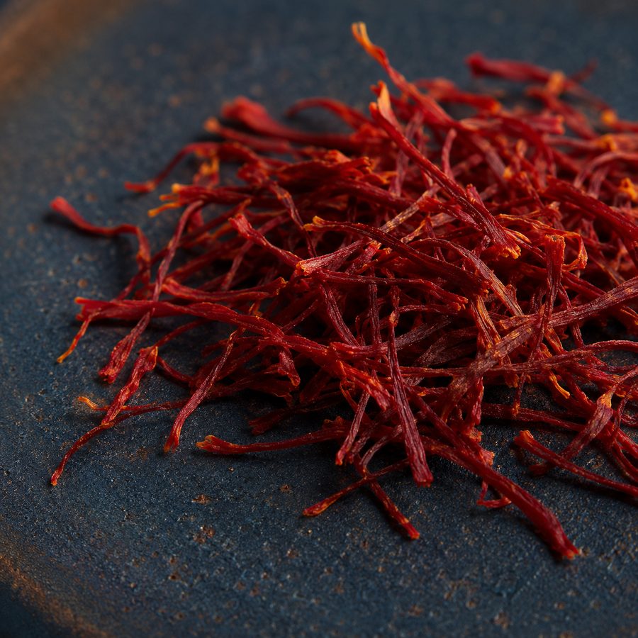 Affron saffron threads on dark indigo ceramic