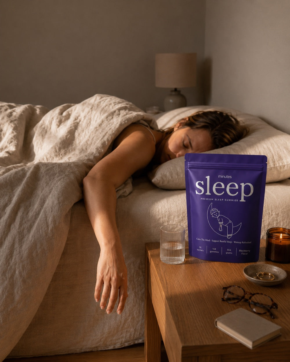 Sleeping deeply, one arm off the bed